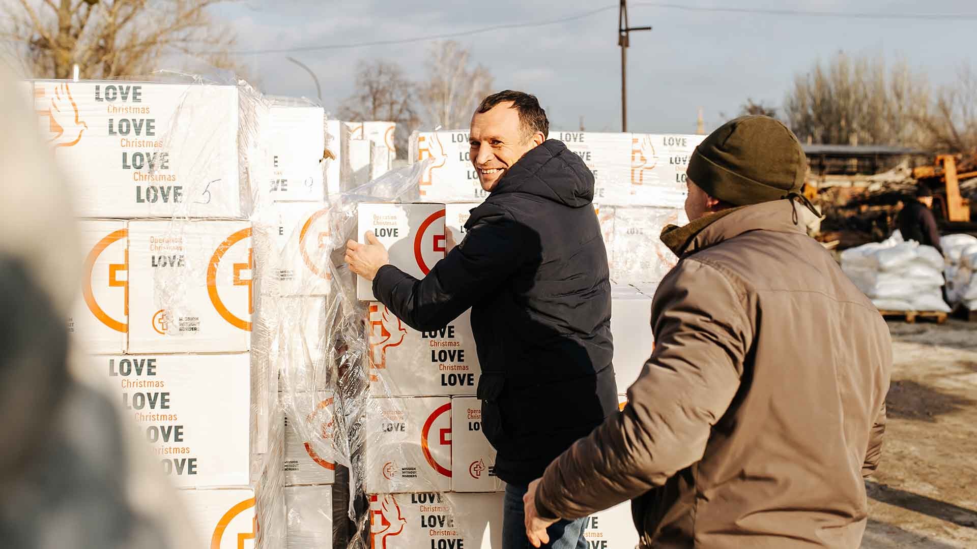 Handing out boxes of supplies, Ukraine.