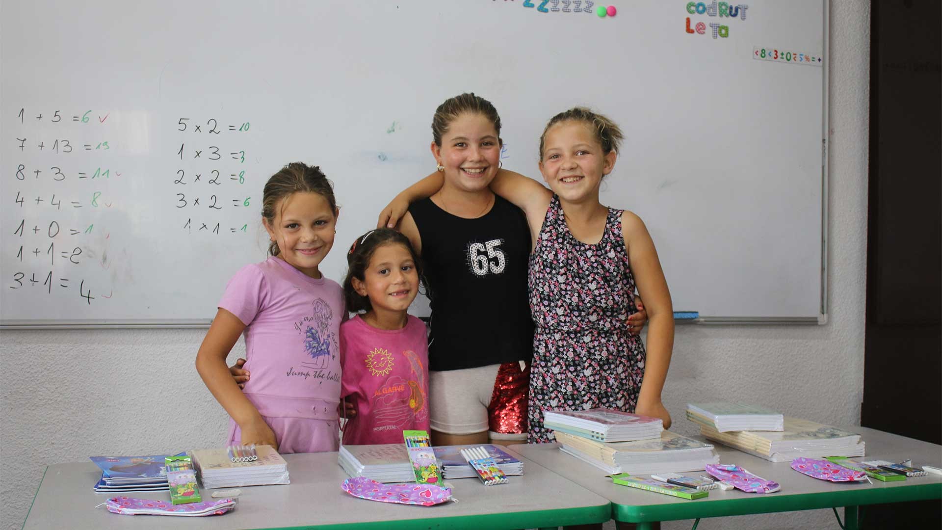 Four children with new resources at an after school club.