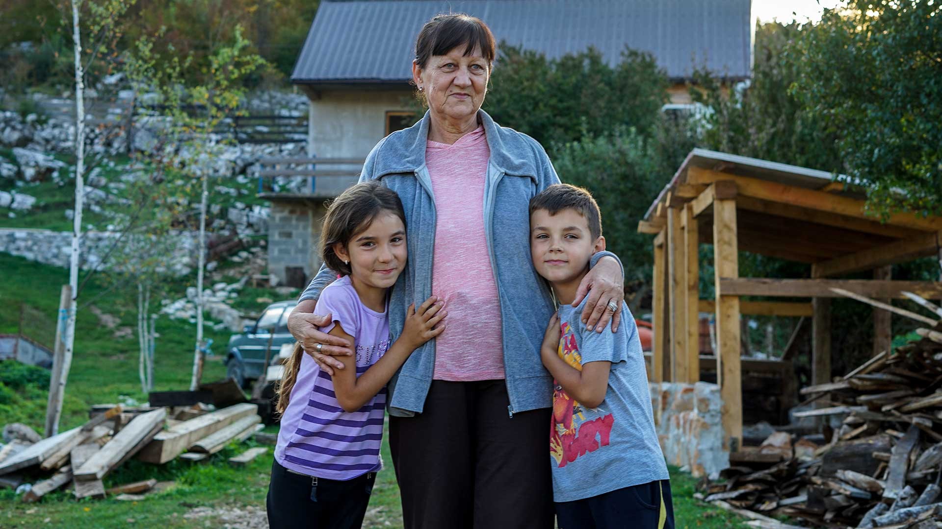 Two children with their grandmother.