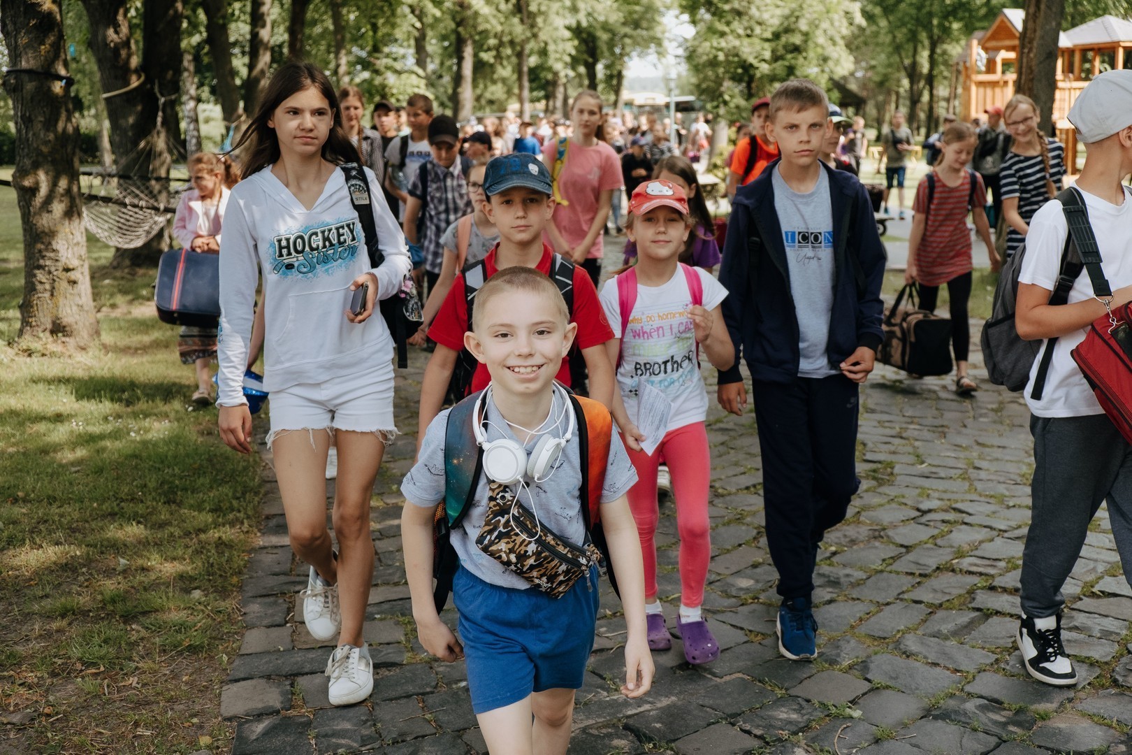 A group of children excited to arrive at summer camp.