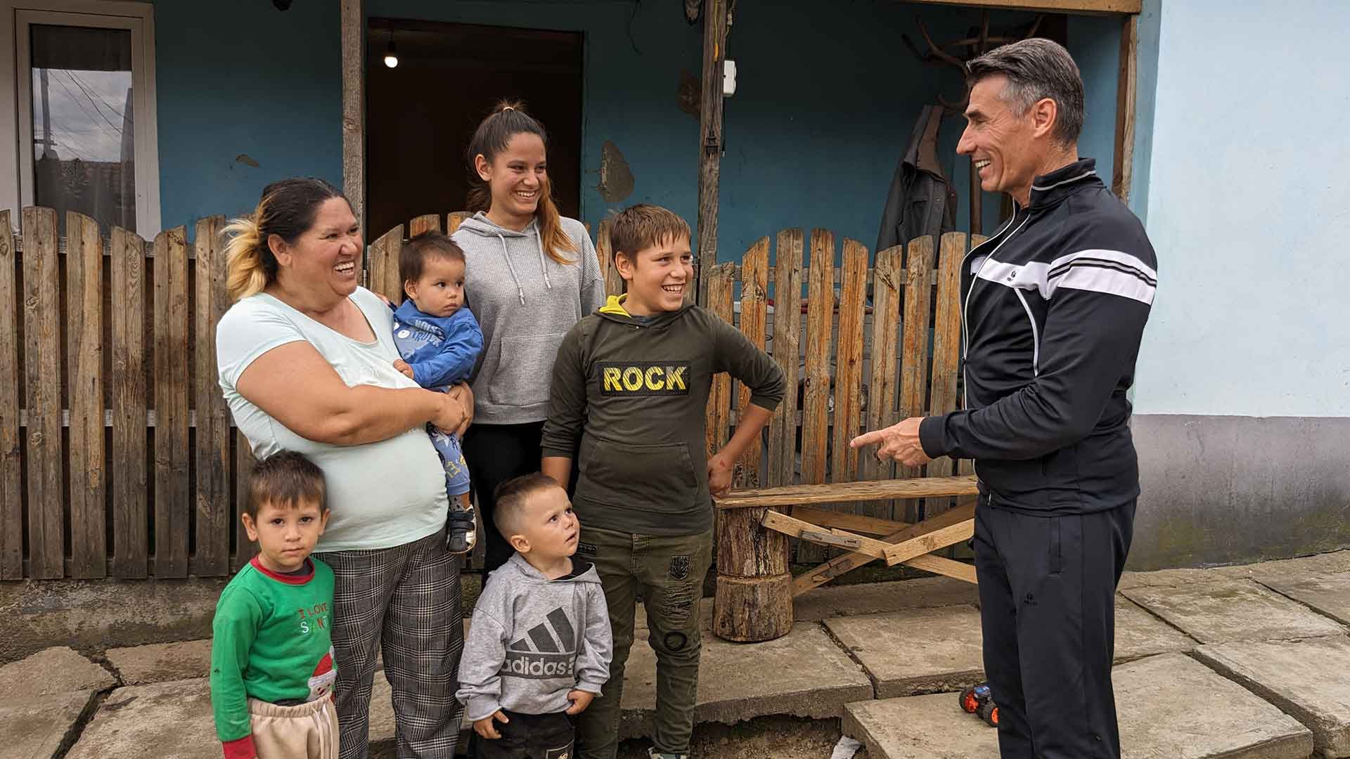 A Mission coordinator talks with a family.